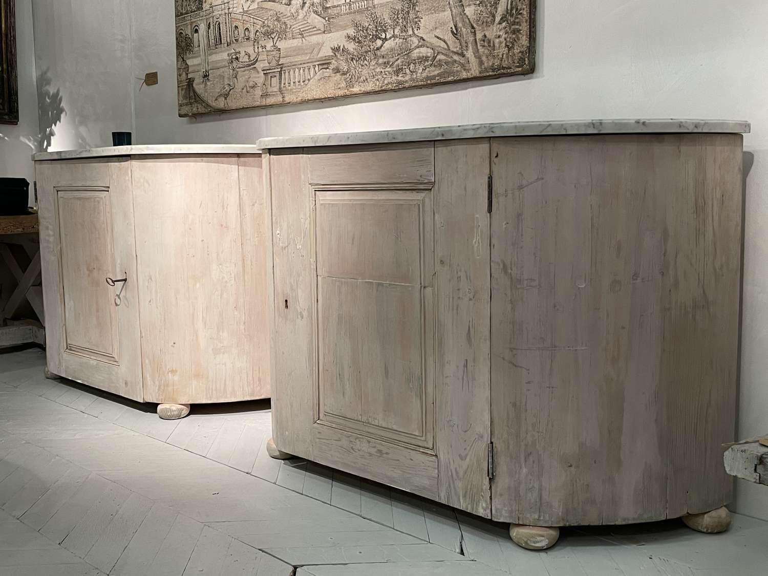 A pair of Italian buffets early 19th century with Carrara marble tops