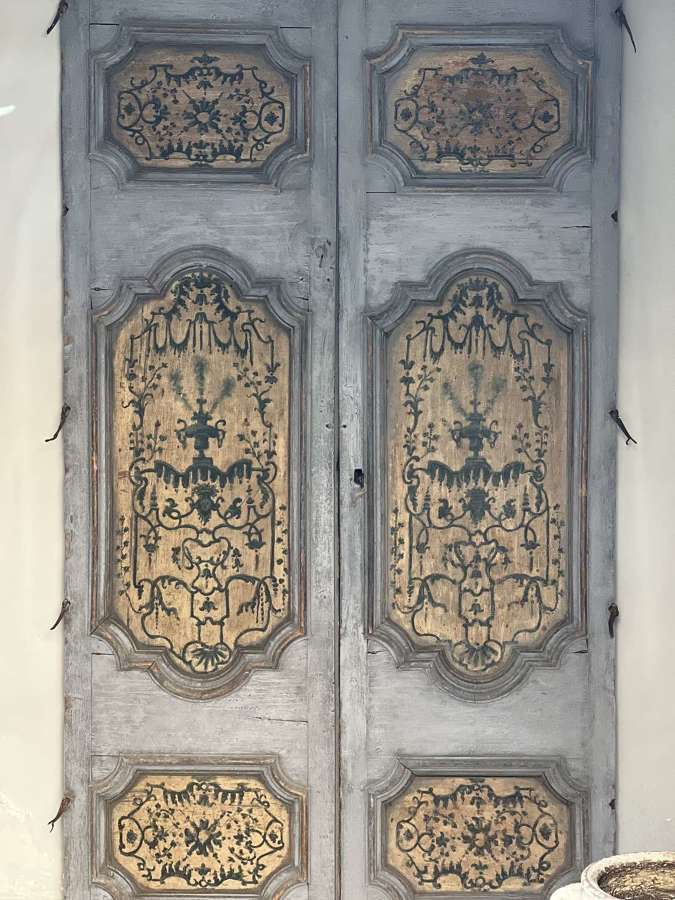 An Italian pair of 18th century painted decorative doors