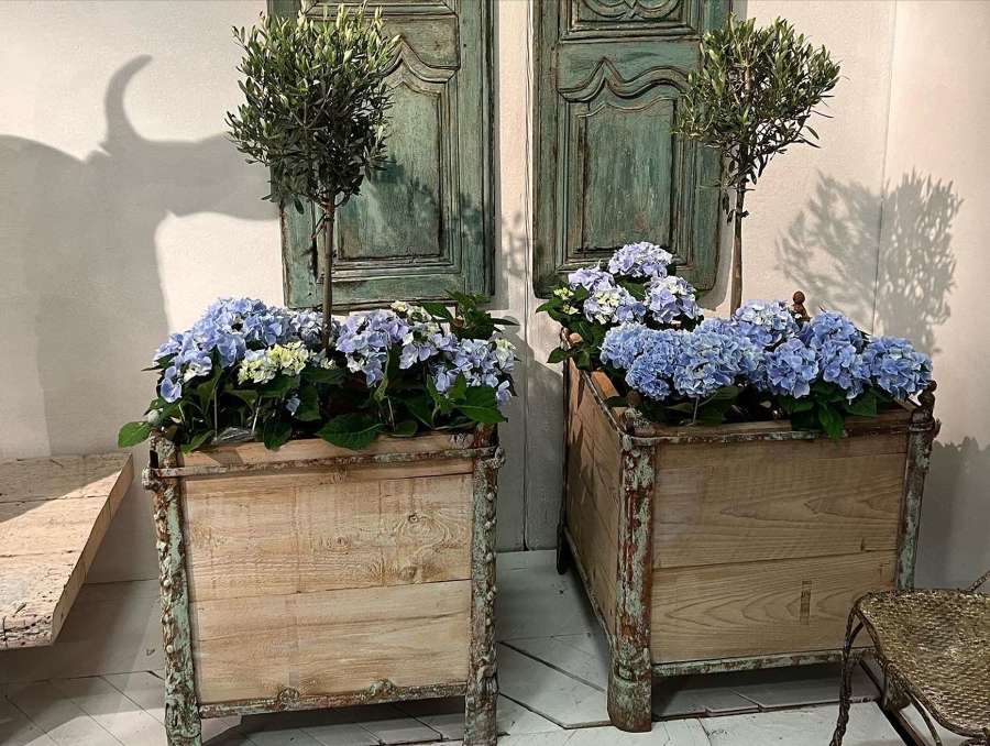 A pair of French 19th century wood and iron Versailles planters