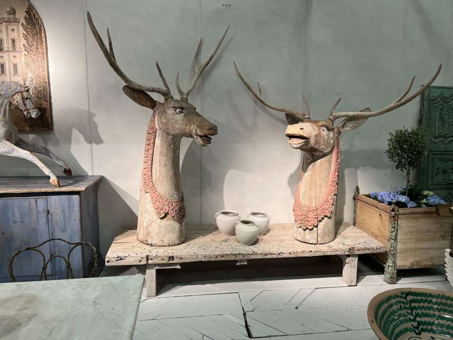 Two decorative wooden reindeer form the garden of Elizabeth Frink